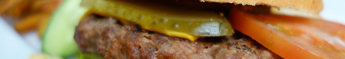 Eating Burger at Omega Burgers Bellflower restaurant in Bellflower, CA.